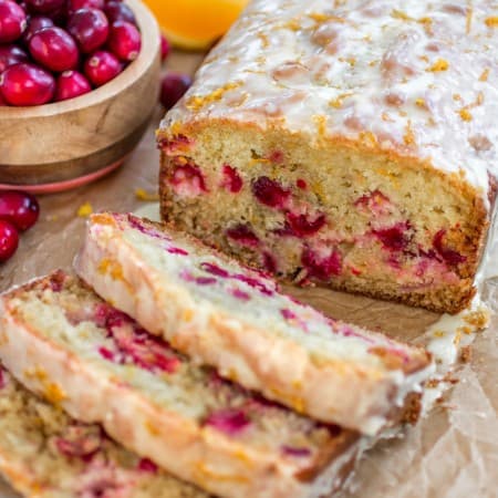 Super moist orange bread studded with juicy cranberries and topped with a sweet, fresh orange glaze. - Sprinkle Some Sugar