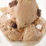 Creamy toasted smores chocolate ice cream scooped into a glass cup.
