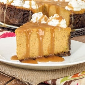 Pumpkin cheesecake slice on a plate.