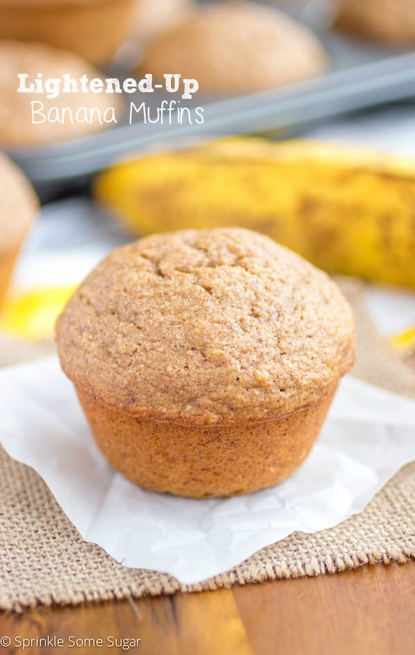 Banana muffin on a piece of parchment paper.