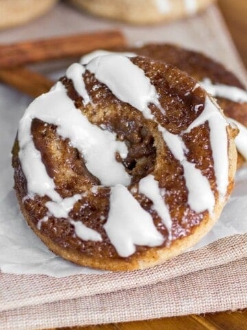 Cinnamon roll donut on parchment paper.