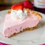 Strawberry yogurt pie slice on a plate.