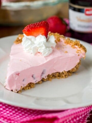 Strawberry yogurt pie slice on a plate.