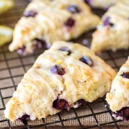 Lemon blueberry scones on a cooling rack.