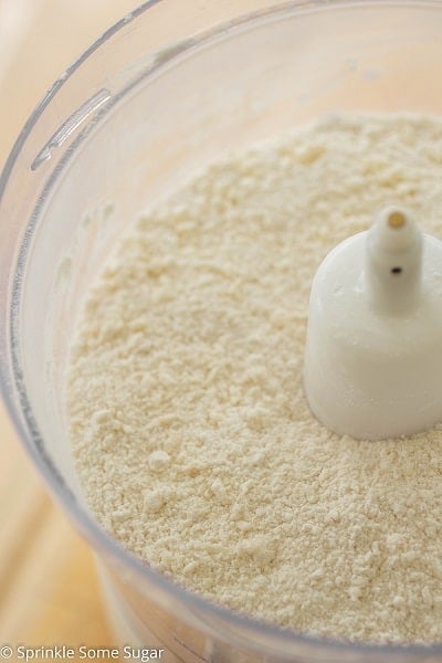 Adding ingredients to food processor for pie crust.
