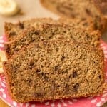 Chocolate chip banana bread on a pink pattern plate.