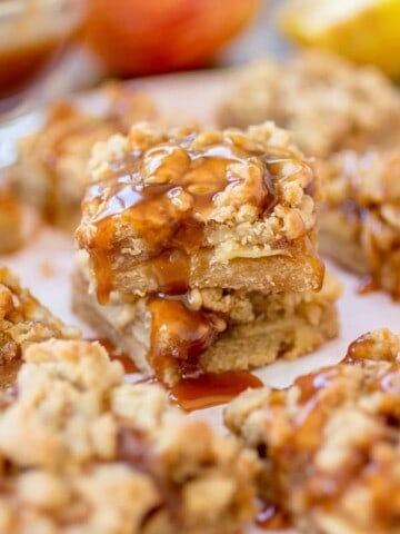 Caramel apple pie bars on parchment.