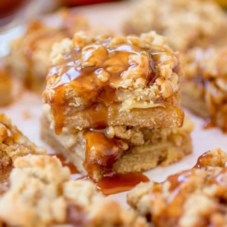 Caramel apple pie bars on parchment.