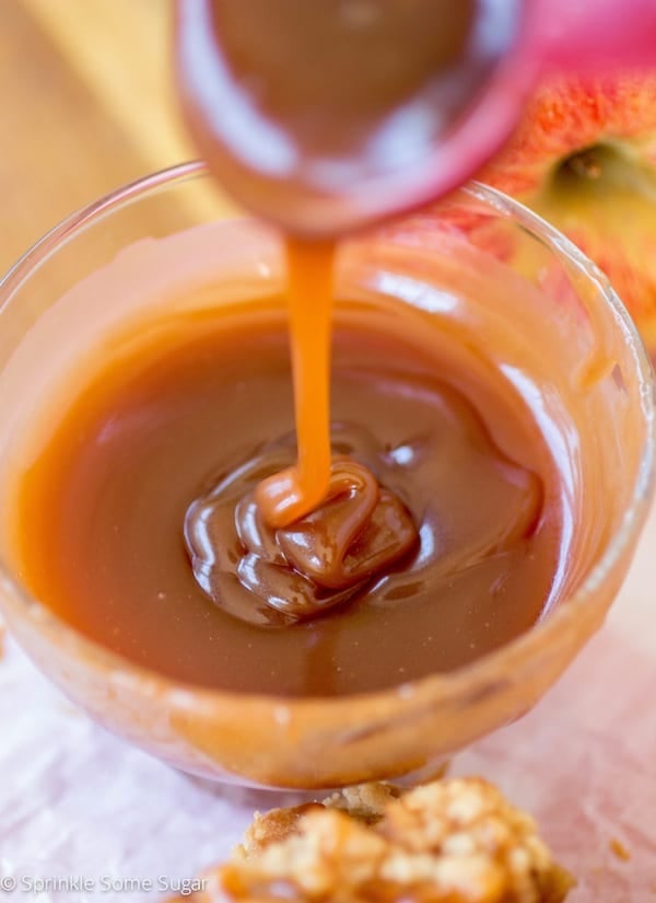 Homemade caramel pour into a bowl.