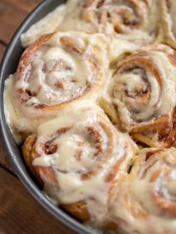 Soft and Fluffy Cinnamon Rolls after baking and slathering icing on top.