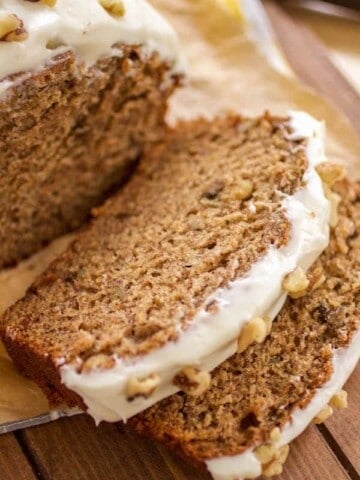 Slice of banana walnut bread with cream cheese frosting