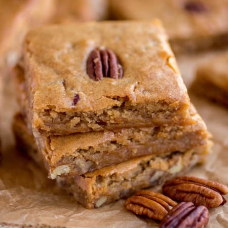 pecan blondies in a stack of three.