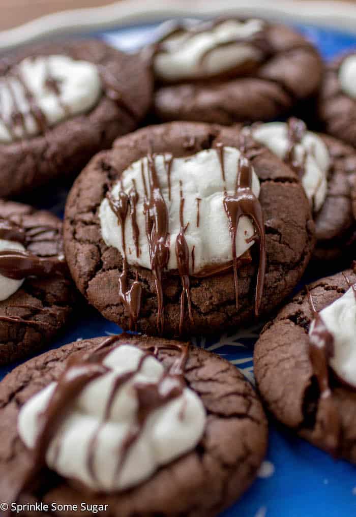 Hot Cocoa Cookies stacked on a blue plate.