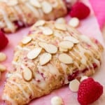 White Chocolate Raspberry Almond Scones stacked on top of each other.