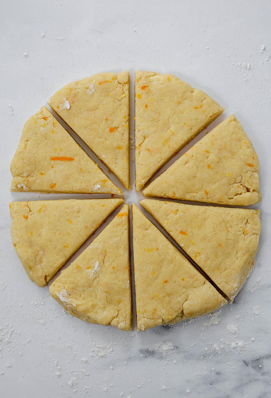 Scone dough pat into a circle and cut into slices.