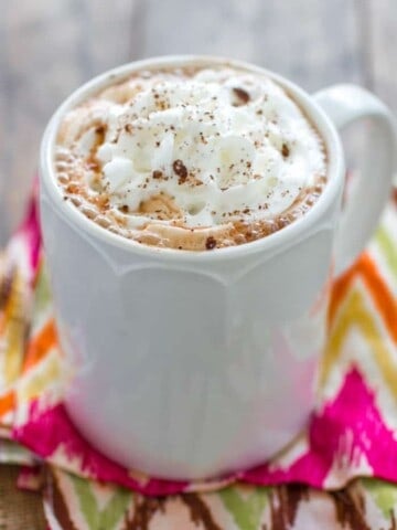 Slow Cooker Mexican Hot Chocolate - Hot Chocolate infused with cinnamon, nutmeg and chili powder to give it a depth of flavor you wouldn't believe until you tried it!