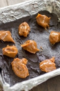 Dulce De Leche Stuffed Brownies - The fudgiest dark chocolate brownies stuffed with dulce de leche. They're irresistible!