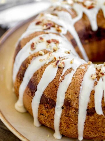 Pecan Cinnamon Roll Bundt Cake - This cake is so soft with a gooey cinnamon swirl in the center! All of the flavors you love about a cinnamon roll, in a super easy cake!
