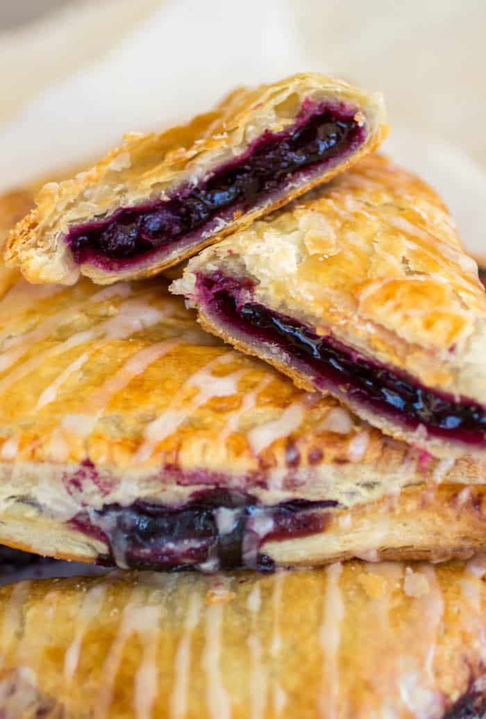 Blueberry Turnovers - Flakey pastry dough is filled with gooey homemade blueberry filling.
