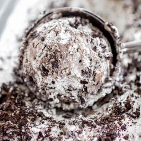 No-Churn Cookies and Cream Ice Cream scooped into ice cream scoop.