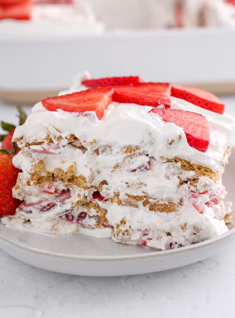 Strawberry icebox cake slice on a plate.