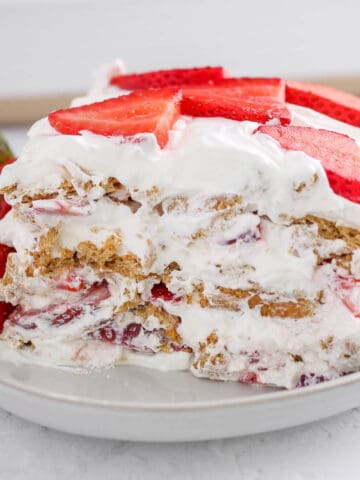 Strawberry icebox cake slice on a plate square.