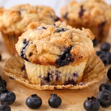 Blueberry Muffins With Crumb Topping with the wrapper unwrapped.