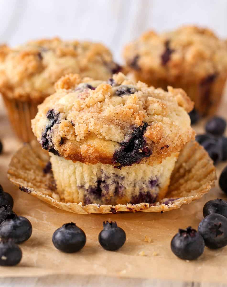 Blueberry Muffins With Crumb Topping with the wrapper unwrapped.