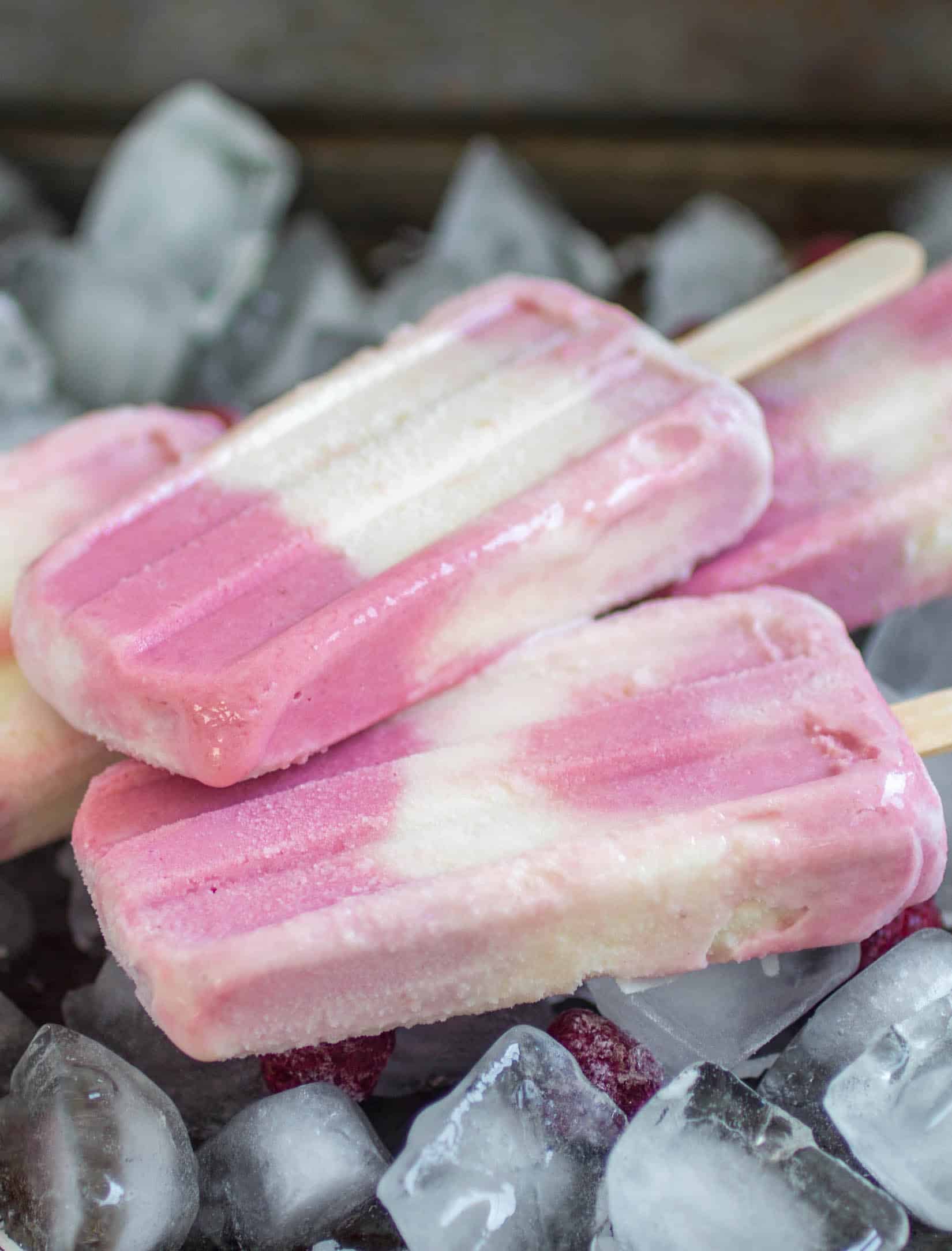 Raspberry Coconut Popsicles - These creamy raspberry coconut popsicles are the perfect treat to cool off on a hot summer day!