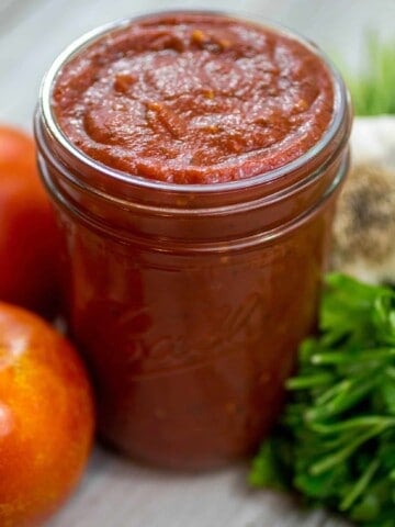 Pizza sauce in a mason jar.