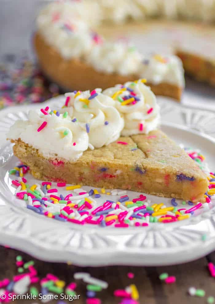 Funfetti Sugar Cookie Cake - A soft and chewy sugar cookie cake filled with sprinkles and topped with a creamy vanilla frosting.
