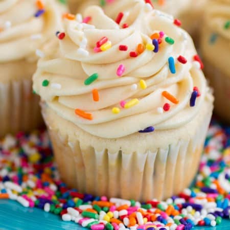 Funfetti Cupcakes with Cake Batter Frosting - My favorite basic fluffy vanilla cupcakes chock full of sprinkles and topped with a creamy cake batter frosting!