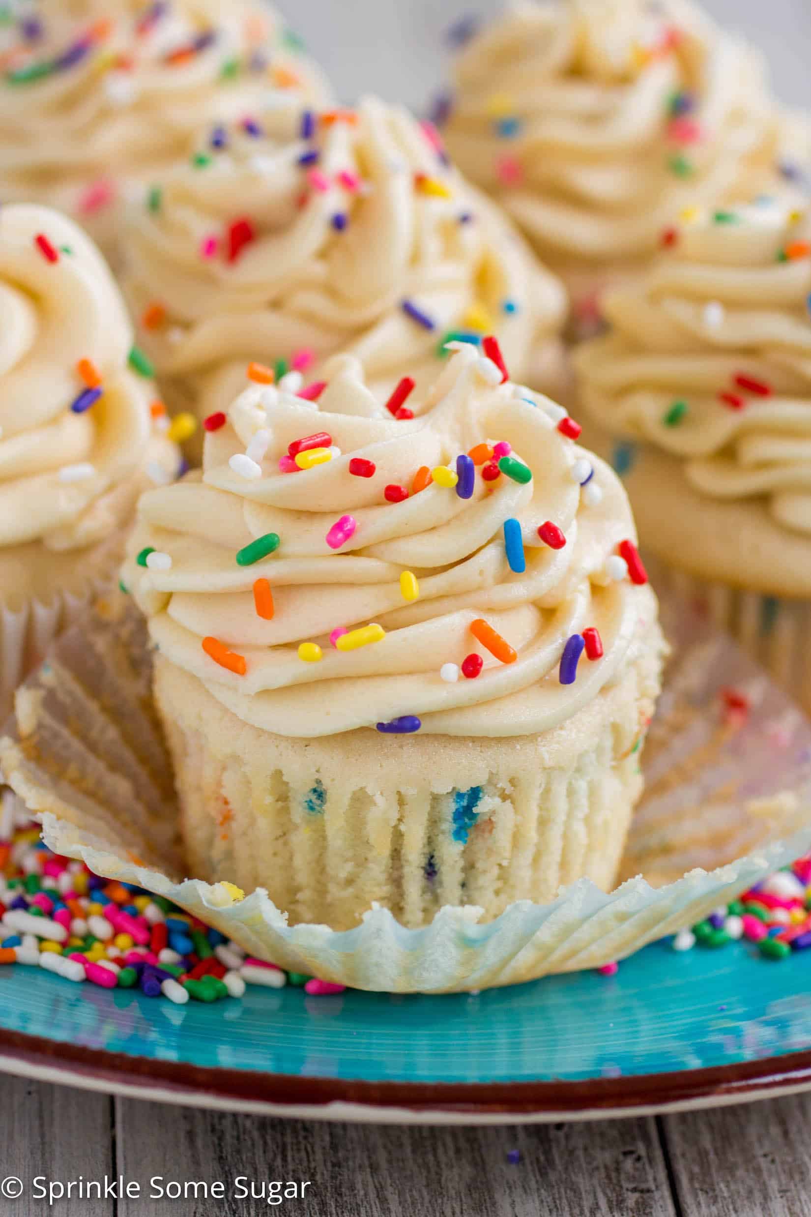  Funfetti Cupcakes with Cake Batter Frosting - My favorite basic fluffy vanilla cupcakes chock full of sprinkles and topped with a creamy cake batter frosting!