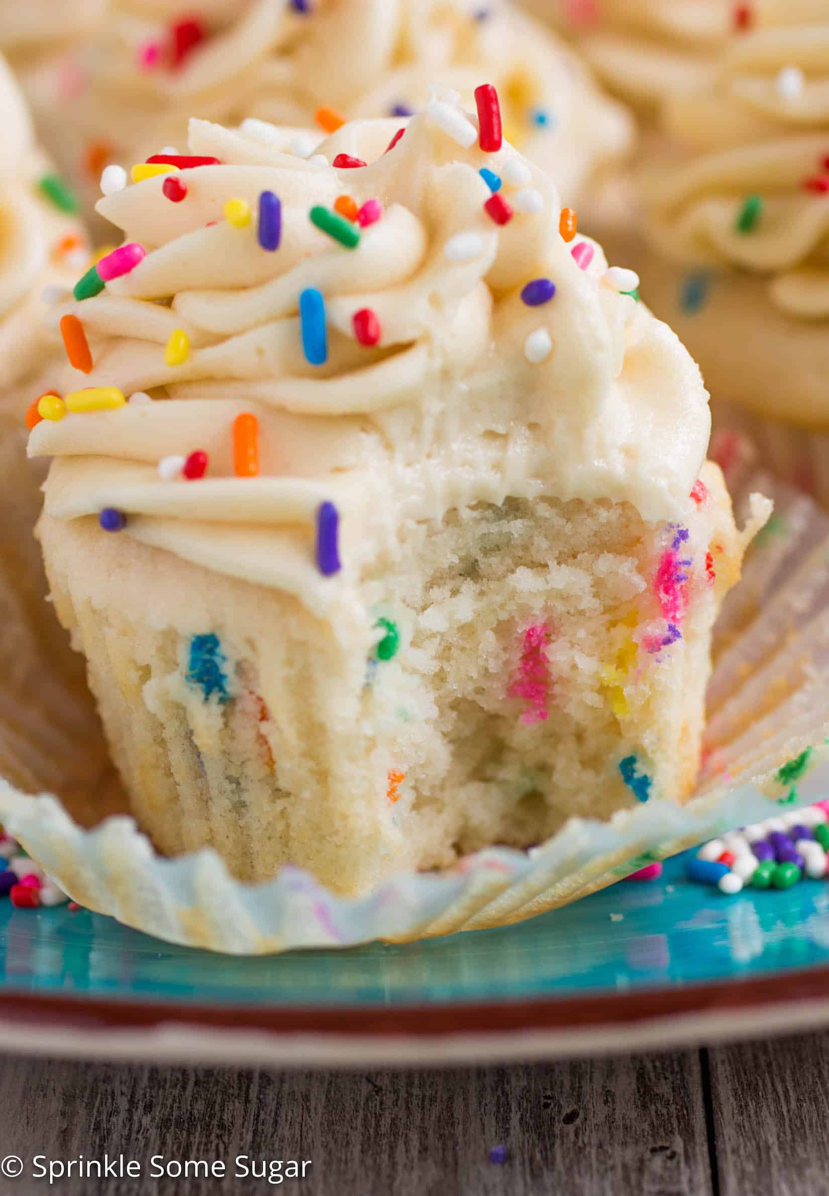  Funfetti Cupcakes with Cake Batter Frosting - My favorite basic fluffy vanilla cupcakes chock full of sprinkles and topped with a creamy cake batter frosting!