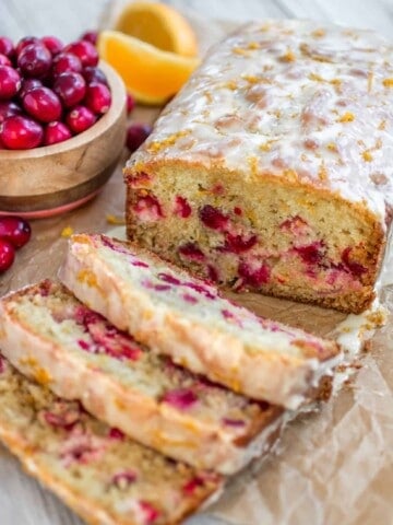 Super moist orange bread studded with juicy cranberries and topped with a sweet, fresh orange glaze. - Sprinkle Some Sugar
