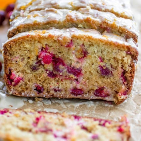 Super moist orange bread studded with juicy cranberries and topped with a sweet, fresh orange glaze. - Sprinkle Some Sugar