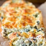 Crispy, crusty french bread gets filled with an extra creamy spinach and artichoke dip. - Spinach and Artichoke Stuffed Bread