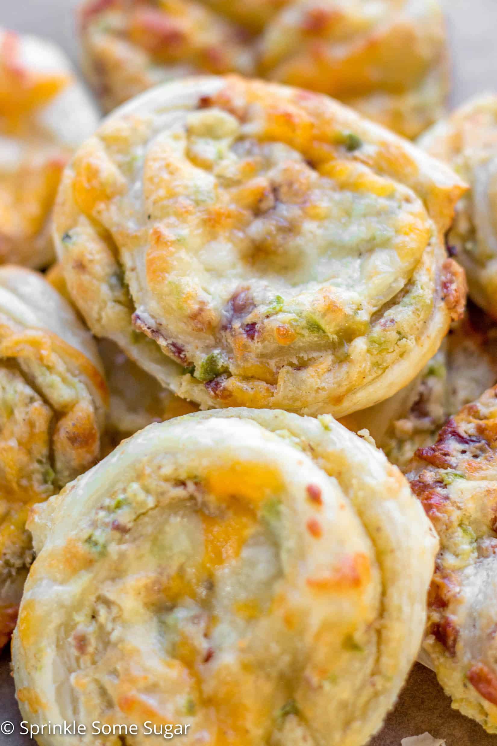 Cheesy Jalapenño Popper Pinwheels - These cheesy jalapeño popper pinwheels incorporate everything you love about a traditional jalapeño popper, all wrapped up in sweet puff pastry dough!