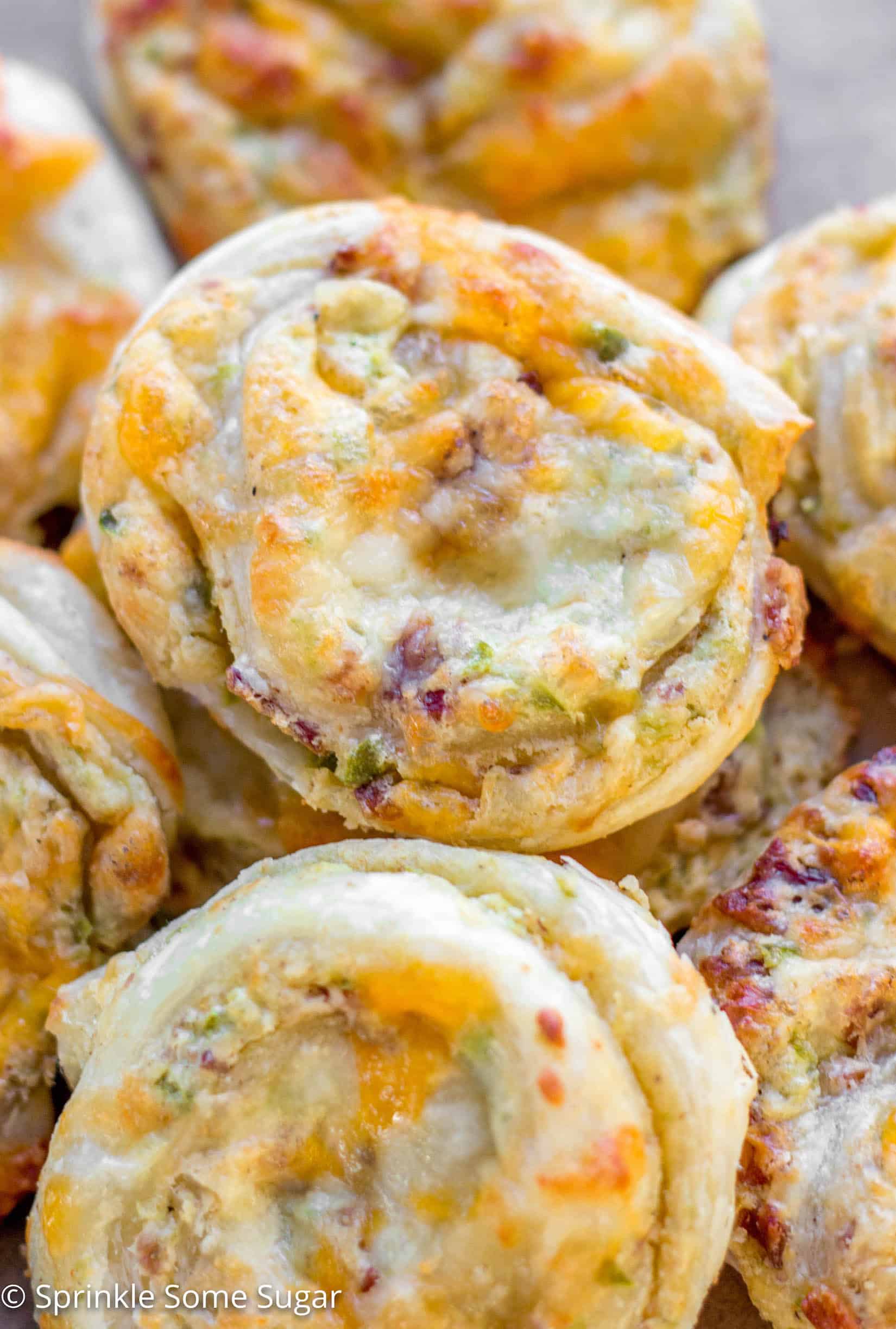 Cheesy Jalapenño Popper Pinwheels - These cheesy jalapeño popper pinwheels incorporate everything you love about a traditional jalapeño popper, all wrapped up in sweet puff pastry dough!