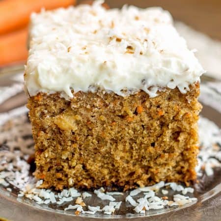 Pineapple Carrot Coconut Cake with Coconut Cream Cheese Frosting - This perfectly moist carrot cake is chock full of carrots, pineapple and coconut. Topped with hefty layer of my favorite coconut cream cheese frosting!