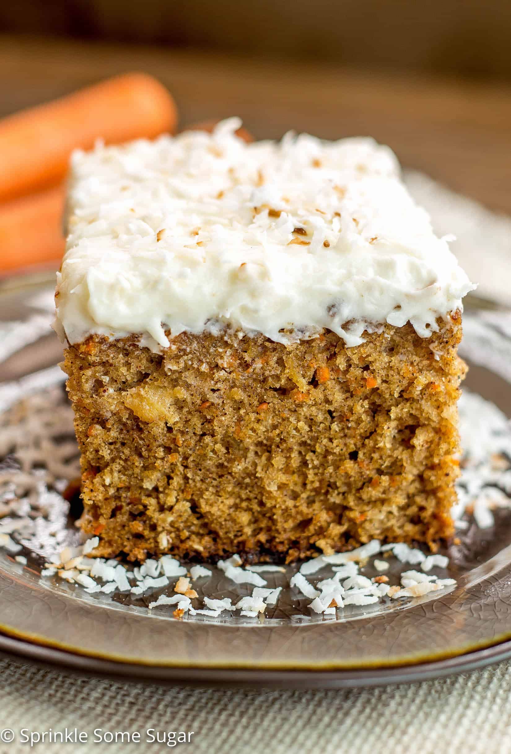 Pineapple Coconut Carrot Cake with Coconut Cream Cheese Frosting - This perfectly moist carrot cake is chock full of carrots, pineapple and coconut. Topped with hefty layer of my favorite coconut cream cheese frosting!