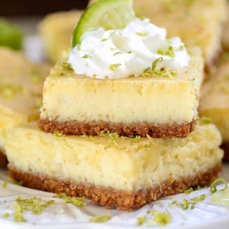 Key Lime Cheesecake Bars - Tart, tangy and sweet, these creamy Key Lime Cheesecake bars are sure to be a crowd pleaser!