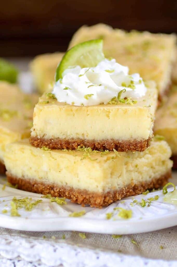 Key Lime Cheesecake Bars - Tart, tangy and sweet, these creamy Key Lime Cheesecake bars are sure to be a crowd pleaser!﻿