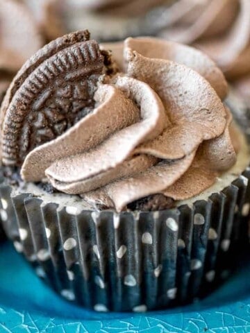 Mini Oreo Cheesecakes with Dark Chocolate Whipped Cream - These creamy mini Oreo cheesecakes with dark chocolate whipped cream are chock full of Oreos with an Oreo crust and topped with homemade whipped cream!