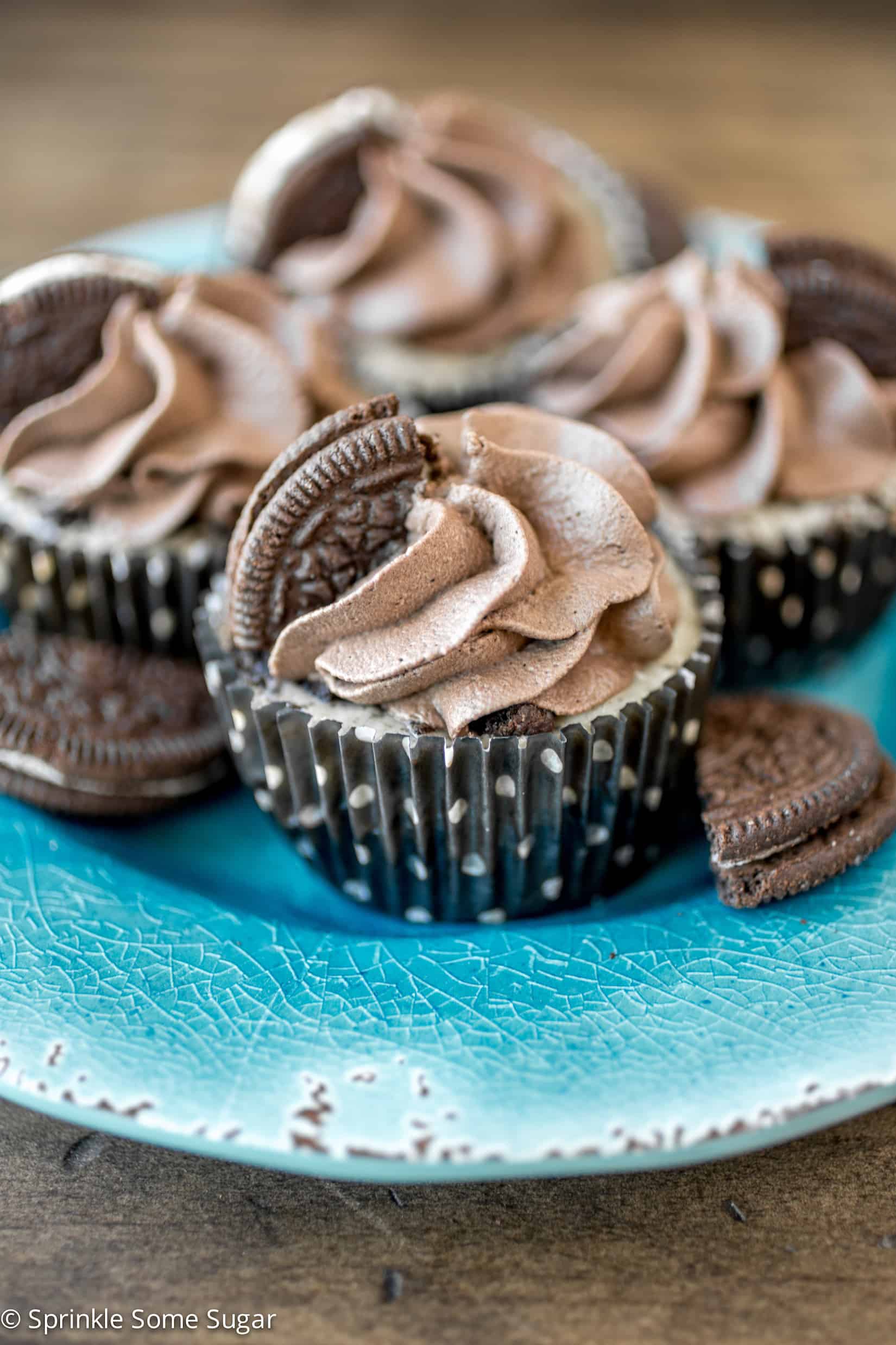 Mini Oreo Cheesecakes with Dark Chocolate Whipped Cream - These creamy mini Oreo cheesecakes with dark chocolate whipped cream are chock full of Oreos with an Oreo crust and topped with homemade whipped cream!