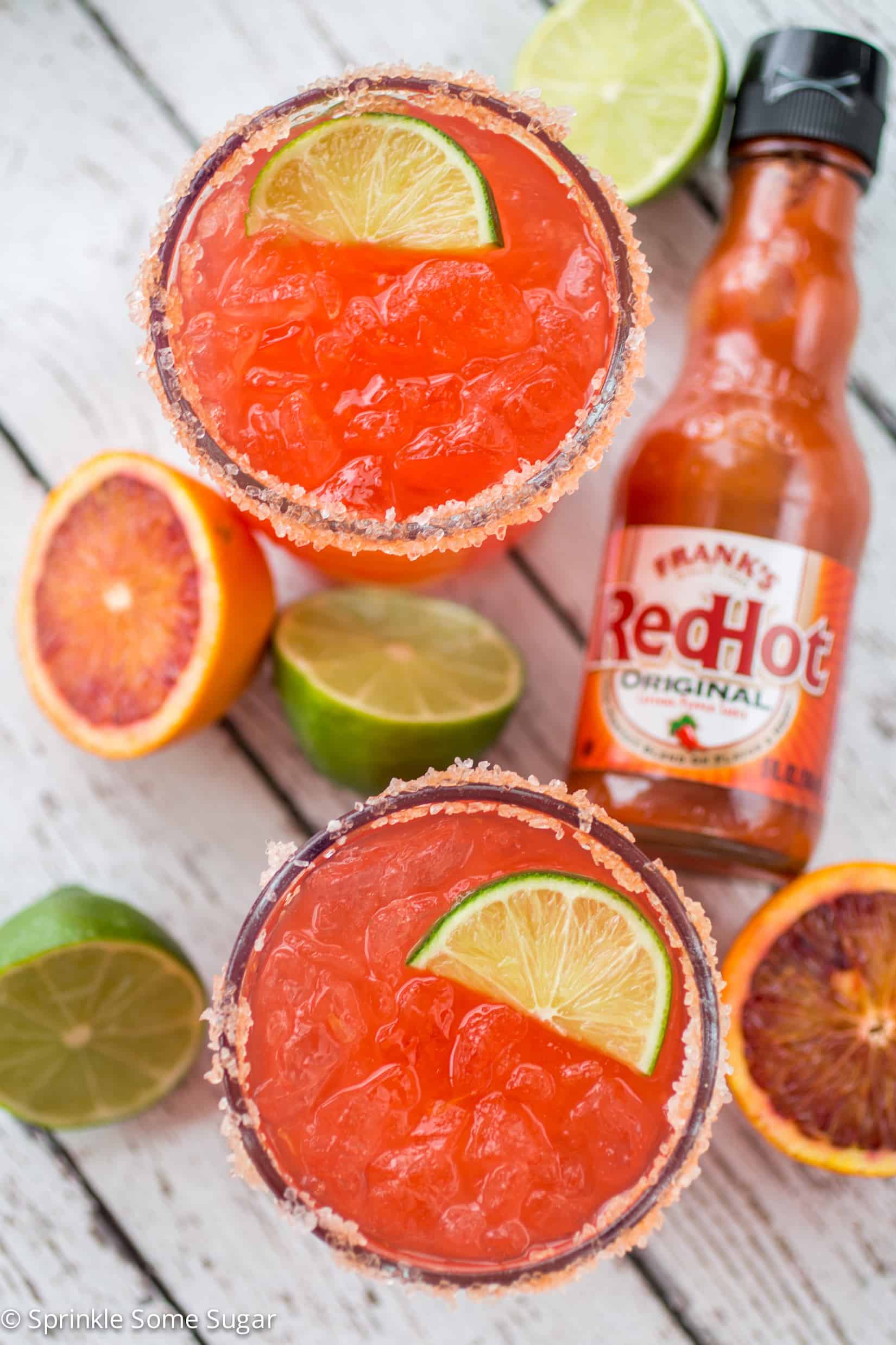 Spicy Blood Orange Margaritas - Margaritas made with freshly squeezed blood orange juice and a few dashes of hot sauce for a sweet and spicy kick!