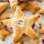 Cherries and Cream Cheese Danish Stars - These cherries and cream danishes are so much fun for the Summer holidays coming up! The dough is flakey, buttery, and crispy on the outside and the inside has a creamy cream cheese filling topped with some homemade cherry preserves!