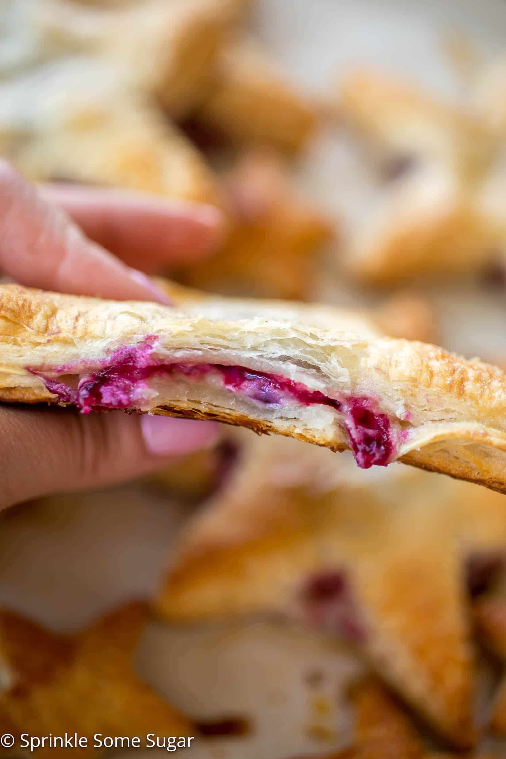 Cherries and Cream Cheese Danish Stars - These cherries and cream danishes are so much fun for the Summer holidays coming up! The dough is flakey, buttery, and crispy on the outside and the inside has a creamy cream cheese filling topped with some homemade cherry preserves!