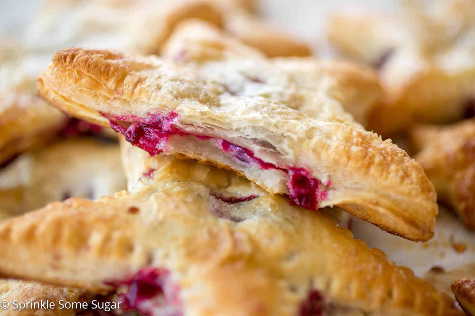 Cherries and Cream Cheese Danish Stars - These cherries and cream danishes are so much fun for the Summer holidays coming up! The dough is flakey, buttery, and crispy on the outside and the inside has a creamy cream cheese filling topped with some homemade cherry preserves!