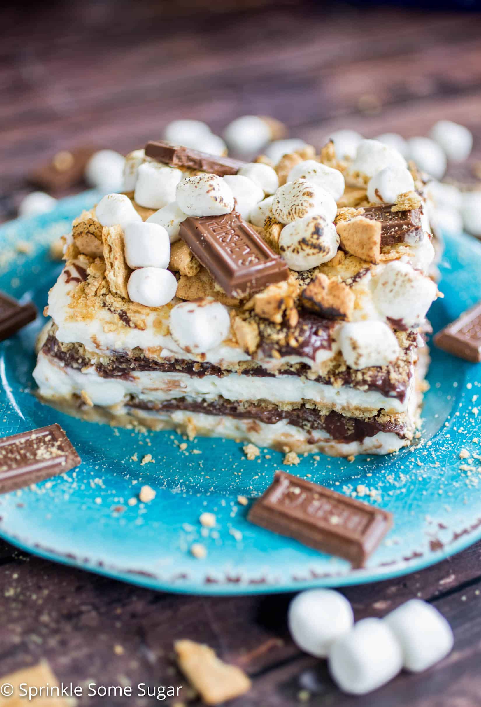 S'mores Icebox Cake - An over-the-top s'mores icebox cake complete with marshmallow whipped cream, soft chocolate ganache, graham crackers and toasted marshmallows!